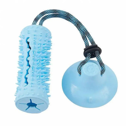 Light blue rubber suction-cup tug toy with spiky chew stick and striped rope handle, on white background.
