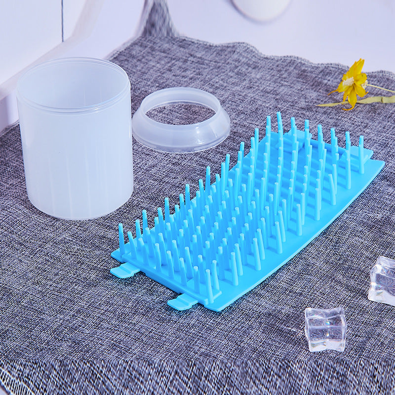 CleanPaws Paw-Cleaner Cup Kit parts shown separated: cup body, retaining ring, and silicone bristle insert