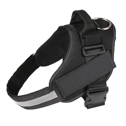 Black no-pull dog harness with padded chest panel, top handle, D-ring, and reflective strip, on white background.