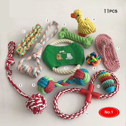 Assorted set of 11 colorful cotton rope dog toys, including tug ropes, knotted balls, a ring, and a rope sandal, laid out and numbered on white.