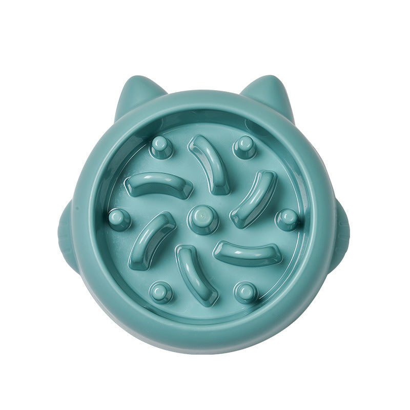 Teal cat-face-shaped slow feeder bowl with raised maze ridges, top-down view on white background.