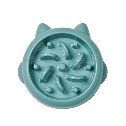 Teal cat-face-shaped slow feeder bowl with raised maze ridges, top-down view on white background.
