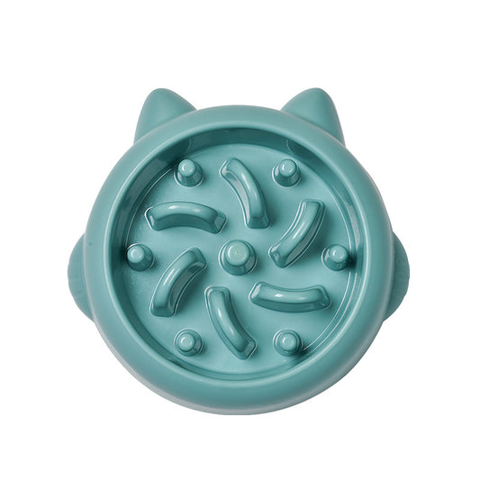 Teal cat-face-shaped slow feeder bowl with raised maze ridges, top-down view on white background.