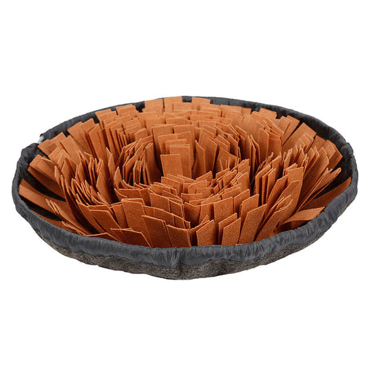 Round grey snuffle mat with orange fabric strips folded to hide treats, on a white background.