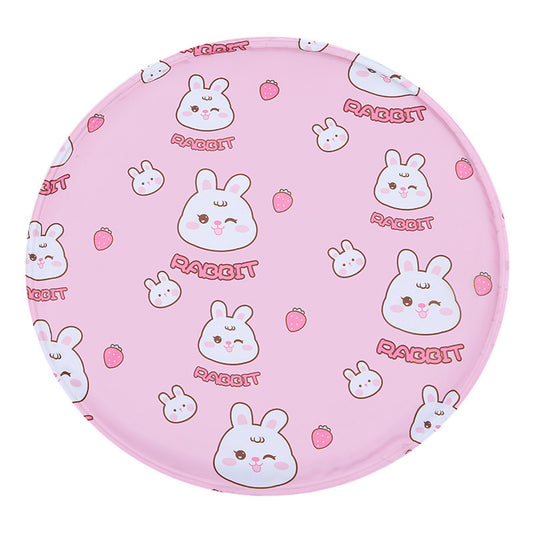 Round pet cooling mat in pink with a white rabbit and strawberry print pattern.