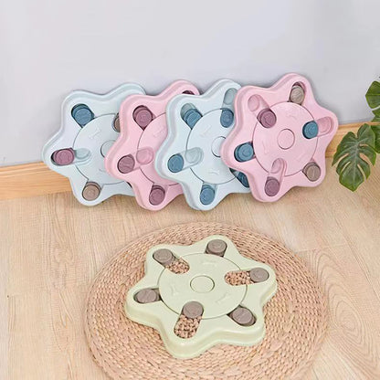 SpinSnack turntable puzzle in pink filled with kibble in every compartment