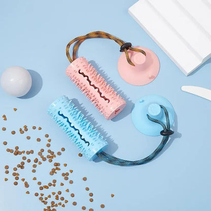 TugAnchor suction tug toy shown in pink and blue side by side with kibble