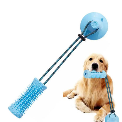 TugAnchor suction tug toy held in a golden retriever mouth, clean lifestyle shot